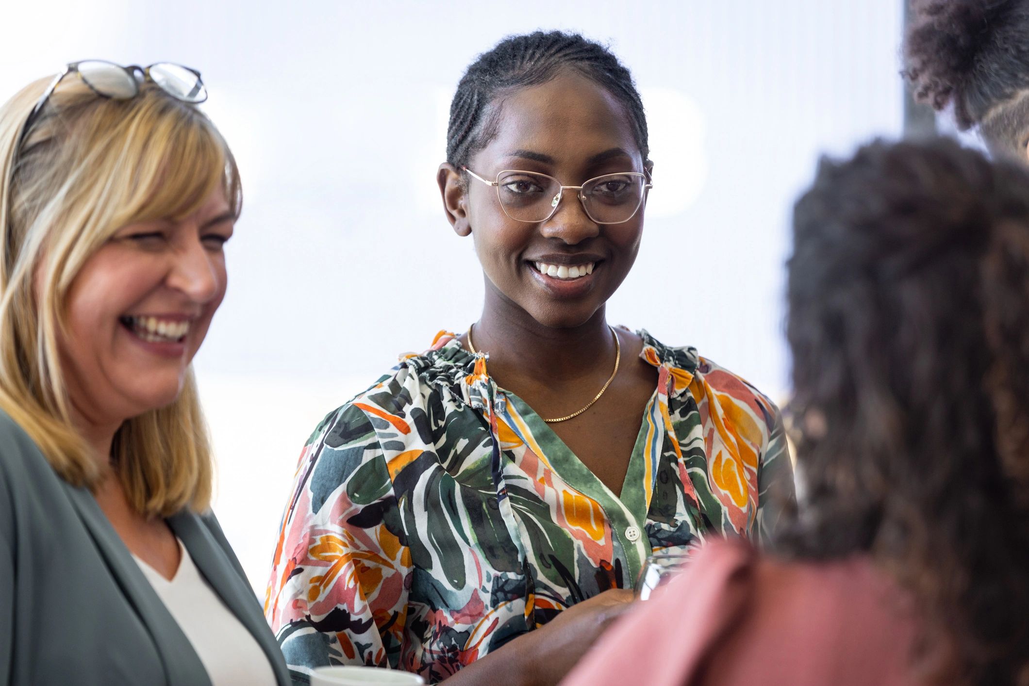 West African technology leaders collaborating in a modern AI-focused office